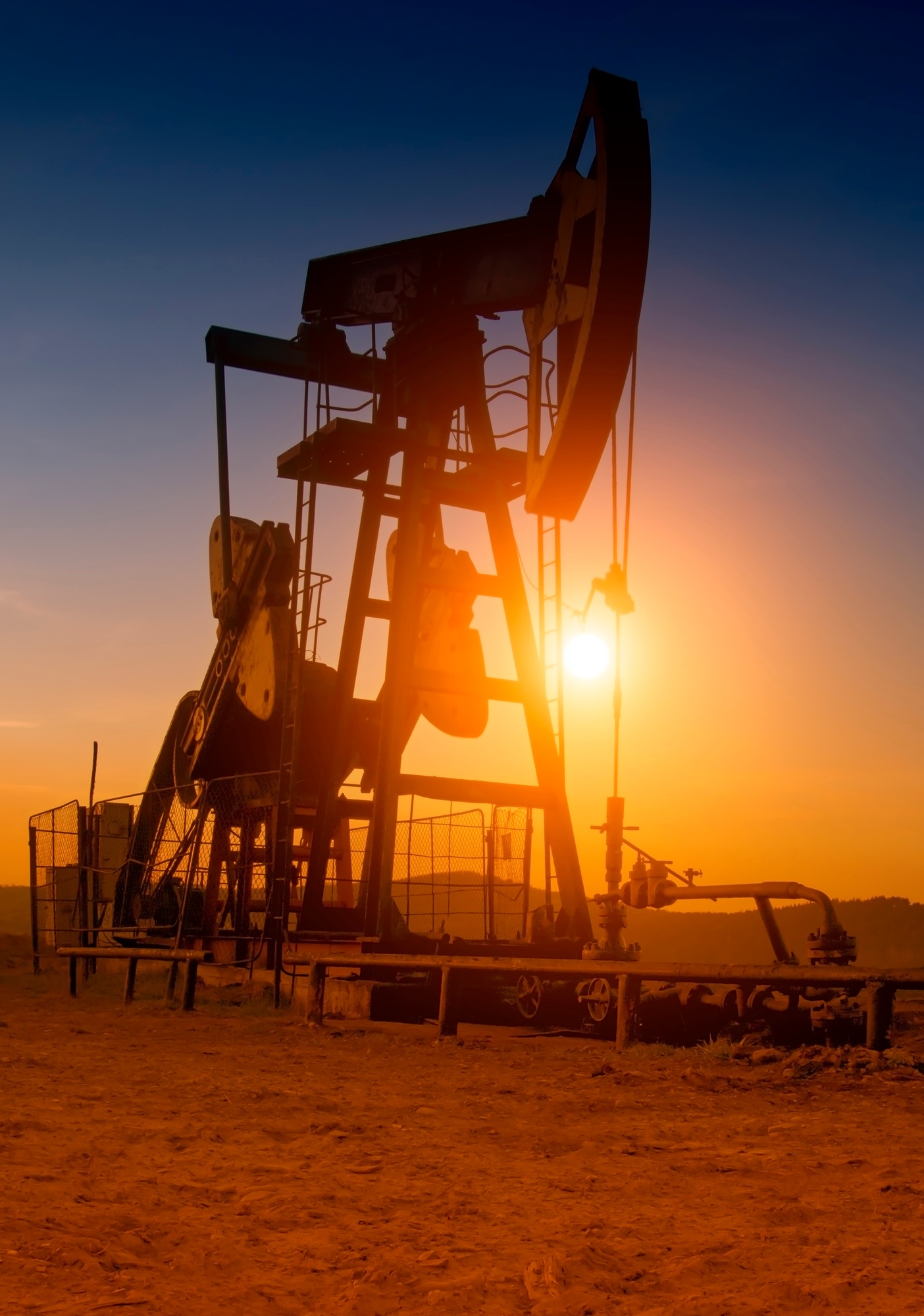 oil pump on sunset